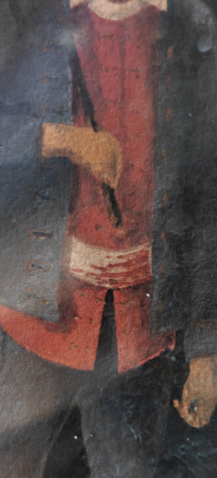6-R. De Jager — detail van hand, rode kleding, blauwe jas en het donkere lange voorwerp/riem bij de romp.
